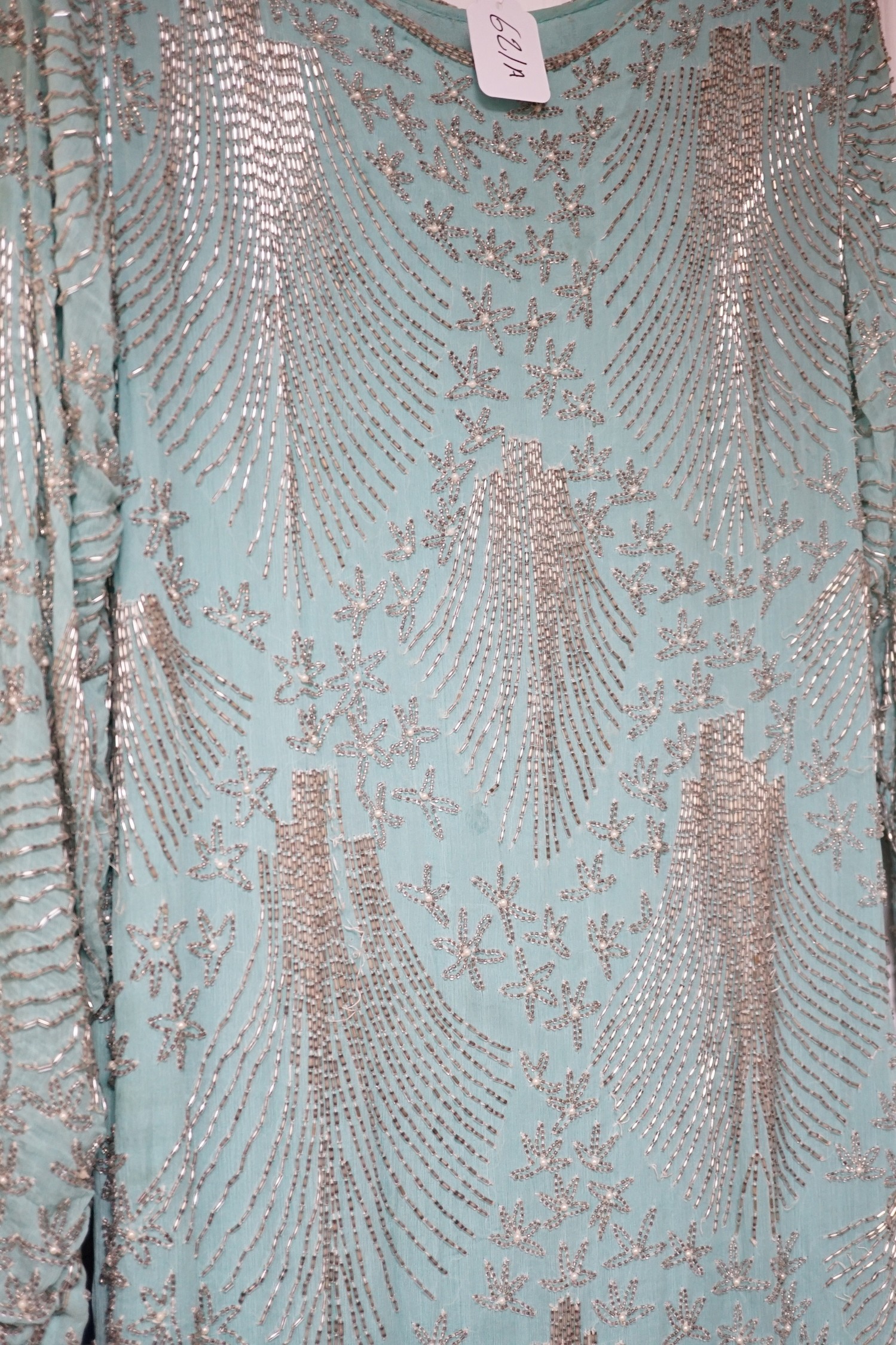A 1940's turquoise chiffon evening dress and peacock designed shawl owned by Princess Sevilla Hercolani